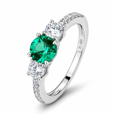 Anello con due zirconi bianchi e Nano Emerald centrale